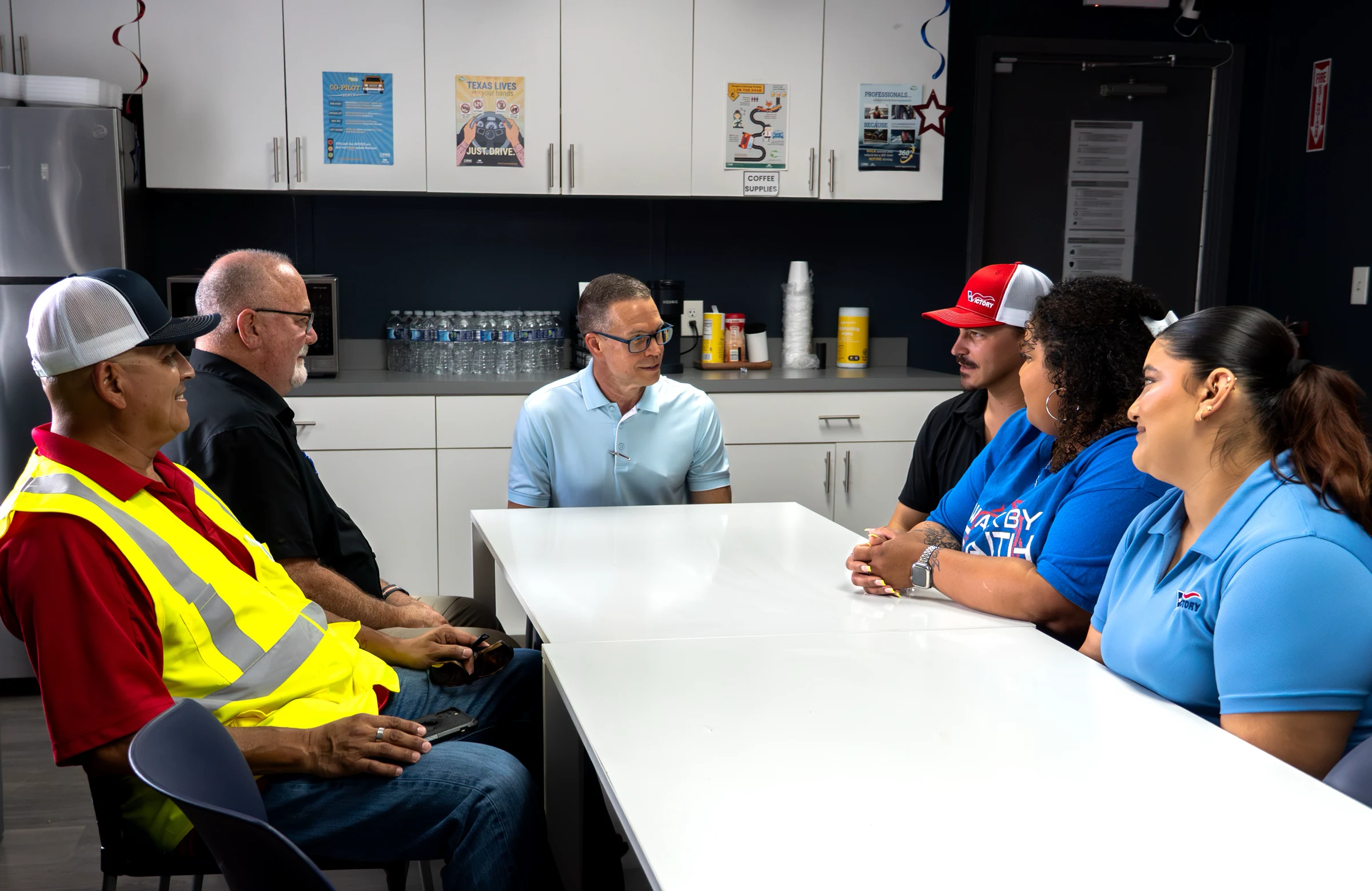 Victory owner operators and office team members meeting together